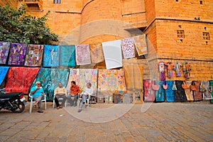 Street vendor selling textile carpets