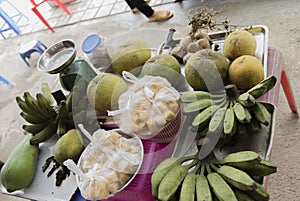 Street vendors act and sell their vegetables and fruit products in Hanoi, Vietnam