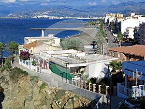 Street view from above straight down the beach front of Torrenueva Costa with Mediterranean sea and mountains photo