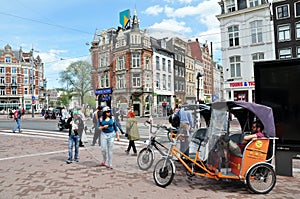 Street view on the busy Muntplein square, Amsterdam, the Netherlands