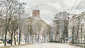 Street view with Gediminas Tower on the hill of the old town center of Vilnius, Lithuania