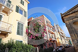 Street view of Kerkyra, capital of Corfu island, Greece. View of Kerkyra with beautiful buildings during summer sunny