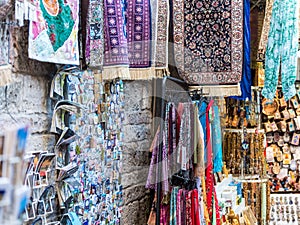 Street view with lots of gifts and presents for tourist in the markets in Al-wad street inside of old city of Jerusalem at the