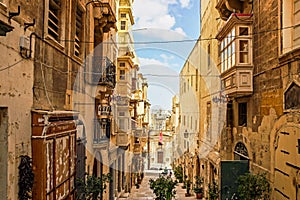 Street view with old limestone building at Valletta in Malta