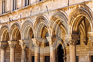 street view of the old town of Dubrovnik in Croatia, arches with columns, architectural details, medieval European architecture,