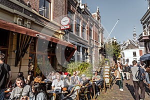 Street view and people eating, drinking outdoor in Utrecht, Netherlands