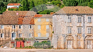 Street view of quaint village homes in Sipanska Luka, Croatia.