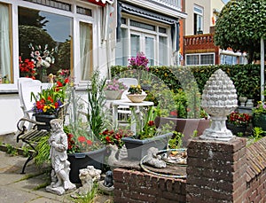 Street view of traditional house decorated with plants