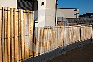 street wall wooden barrier slats around the house fence protection garden access home