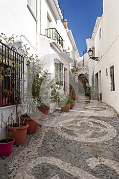 Street with pots in Frigiliana photo