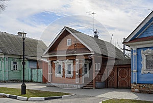 A street with wooden houses of the 19th century with carved platbands in Gorodets, Russia