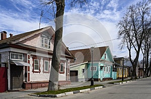 A street with wooden houses of the 19th century with carved platbands in Gorodets, Russia