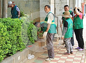 Street workers are doing some work outdoor in Kunming, China