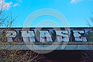 Streetart, the word:phase on a bridge photo