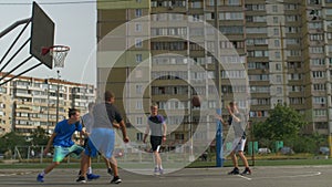 Streetball player taking a shot during basketball game