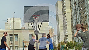 Streetball teenager missing a shot after assist