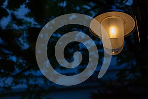 Streetlamp against a dark blue and black background