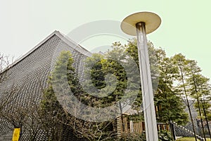 Streetlamp before Chinese modern buildings in sunny spring