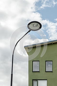 Streetlamp and facade of a green house