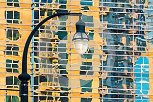 Streetlight on the background of skyscraper