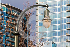 Streetlight on the background of skyscrapers