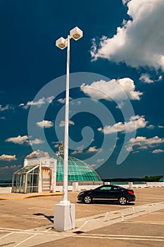 Streetlight and car on top of a parking garage in Towson photo