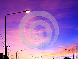 Streetlight with highlight on fantasy sky background and pink clouds after sunset