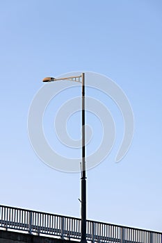 low angle view of a streetlight on the bridge