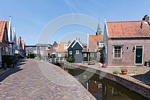 Streets and canals of Volendam on a sunny day and blue sky. Netherlands, Europe
