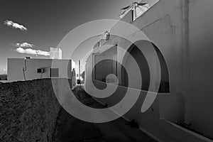 Streets and courtyards of the white city of Oia on the island of Santorini. Greece