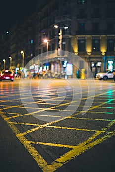 Streets intersection painted in yellow in the city during night