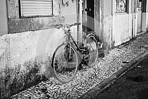 Streets of Lisbon. Old bicycle. Black and white photo. B&W. Street photography