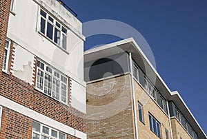 Streets of London, England - modern flats and blue skies on a sunny day.