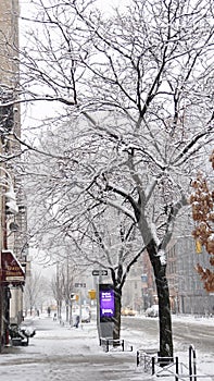 Streets of Manhattan in the snow at winter in New York City, USA.