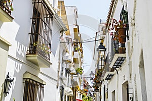 Streets of Marbella in Spain with flowers and plants on the faca