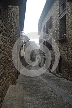 Streets Of The Medieval Village Of Ainsa In A Day Of Mild Fog. Travel, Landscapes, Architecture. December 26, 2014. Ainsa, Huesca