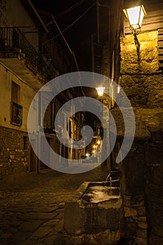 Streets of the village of La Alberca illuminated at night, Salamanca, Spain photo
