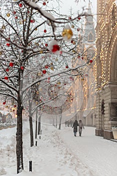 Streets of Moscow decorated for New Year and Christmas celebration. Tree with bright red and yellow balls. Russia