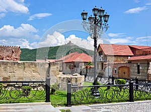 Streets of Mtskheta town and Jvari Monastery on a hill, Georgia