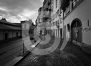 On the streets of the old town of Porto. Madeira street near SÃ£o Bento train station. Porto. Portugal. Black and white