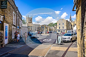 Streets and shops and market cross in historic cotswold town of Stow on the Wold