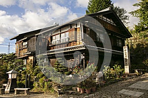 Streets and traditional Japanese houses at Magome Juku town along the Nakasendo trail in Kiso Valley, Japan.