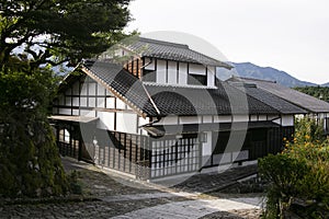 Streets and traditional Japanese houses at Magome Juku town along the Nakasendo trail in Kiso Valley, Japan.