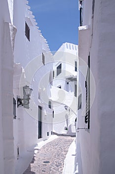 Streets and white walls of touristic fishing village of Binibeca Vell