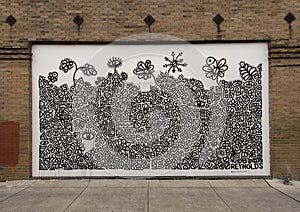 Streetside black and white mural by Ben Reynolds in Deep Ellum in East Dallas, Texas. photo