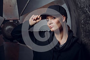 Streetstyle, fashion. Young girl posing on propellers background