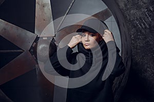 Streetstyle, fashion. Young girl posing on propellers background