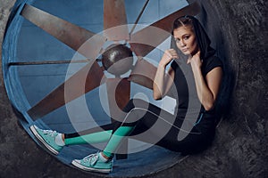 Streetstyle, fashion. Young girl posing on propellers background