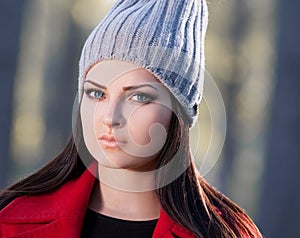 Strelnikova_Svetlana. Woman face red coat and gray hat, blue con