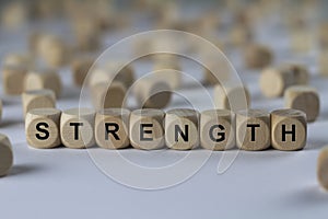 Strength - cube with letters, sign with wooden cubes